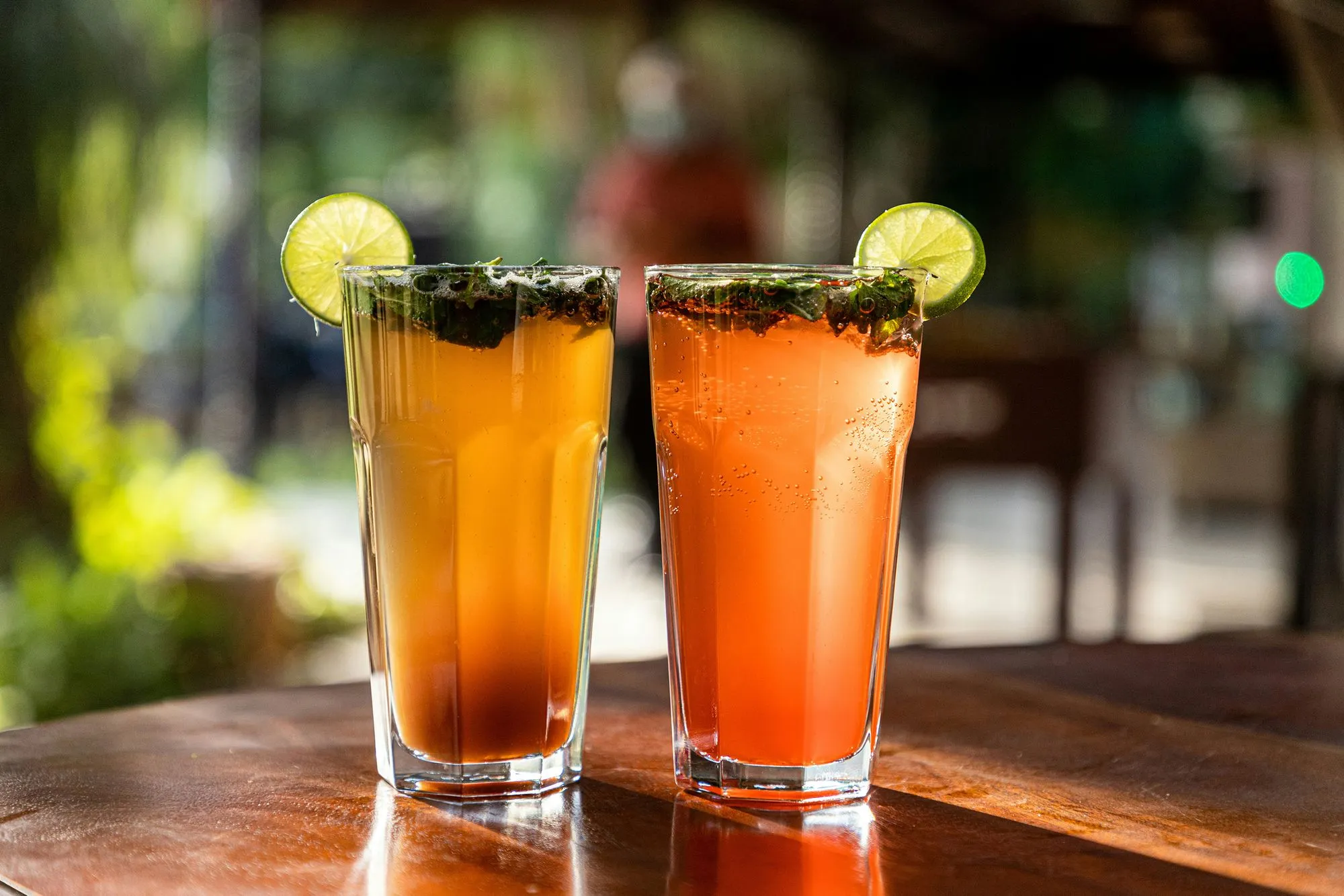 Colorful drinks with lime garnish